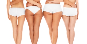 A picture of four sexy female butts over white background